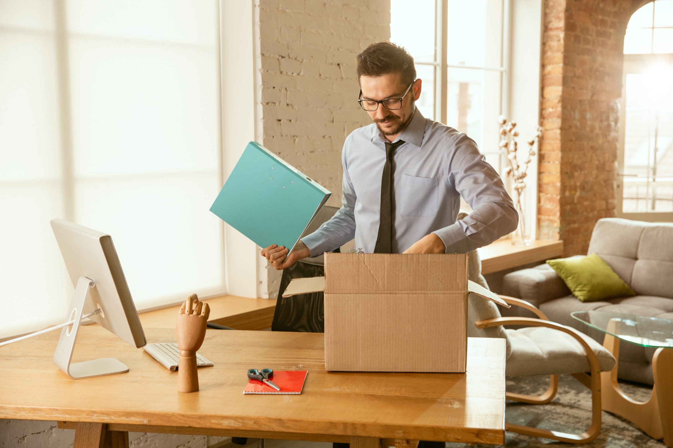 An Employee Packing his Office Stuff Himself